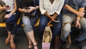 Group of diverse people riding a train