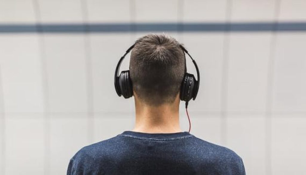 selective-focus-photo-of-man-wearing-black-headphones